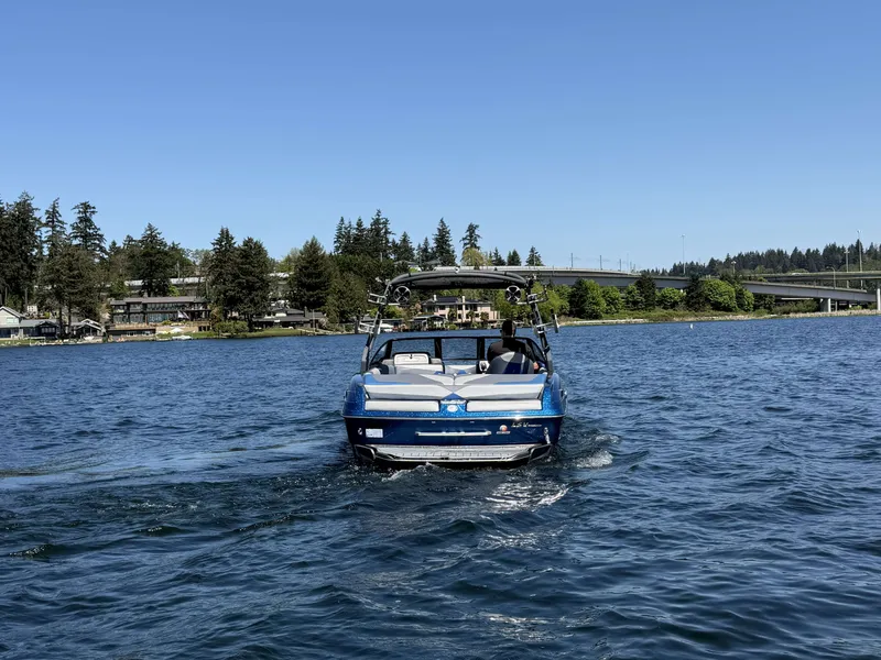 Slide: The Image of 2017 Malibu Wakesetter 23 LSV on a calm lake. - 12