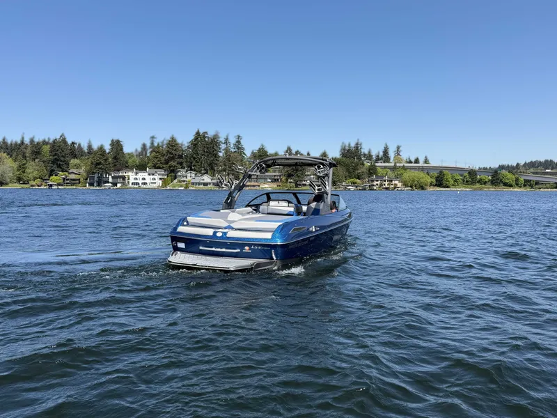 Slide: The Image of 2017 Malibu Wakesetter 23 LSV on a serene lake. - 13