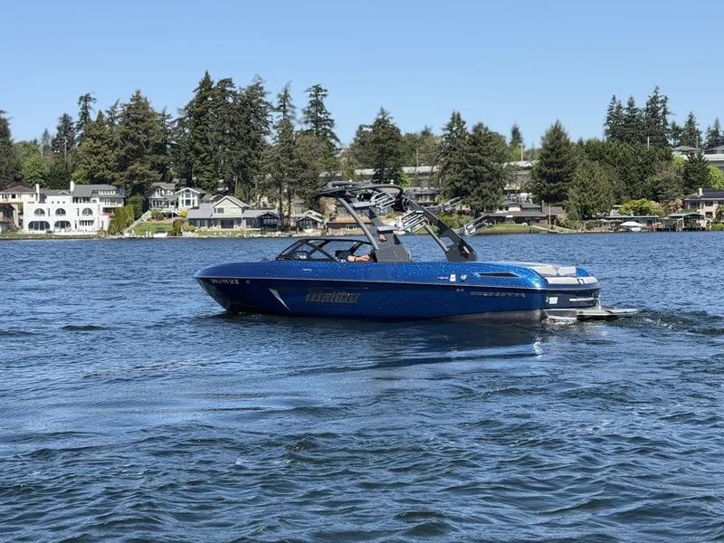 Slide: The Image of 2017 Malibu Wakesetter 23 LSV on a serene lake. - 14