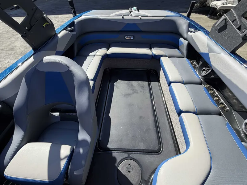 Slide: The Image of Interior of a 2017 Malibu Wakesetter 23 LSV with blue and gray seating. - 17