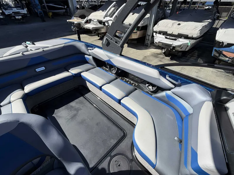 Slide: The Image of Interior of a 2017 Malibu Wakesetter 23 LSV with blue and gray seating. - 18