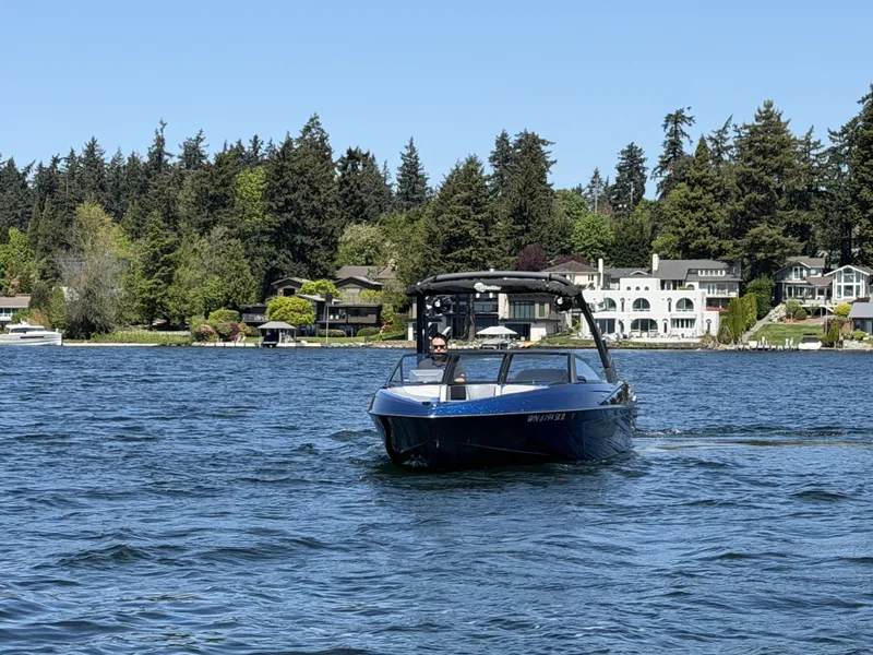 Slide: The Image of 2017 Malibu Wakesetter 23 LSV on a serene lake. - 3