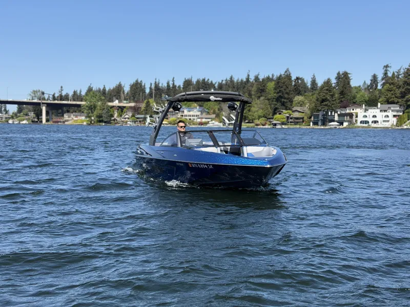 Slide: The Image of 2017 Malibu Wakesetter 23 LSV on a lake under sunny skies. - 4