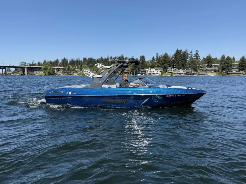 Slide: The Image of 2017 Malibu Wakesetter 23 LSV on a lake under clear skies. - 7