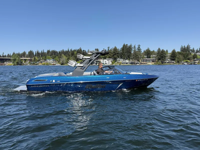 Slide: The Image of 2017 Malibu Wakesetter 23 LSV on a serene lake. - 8