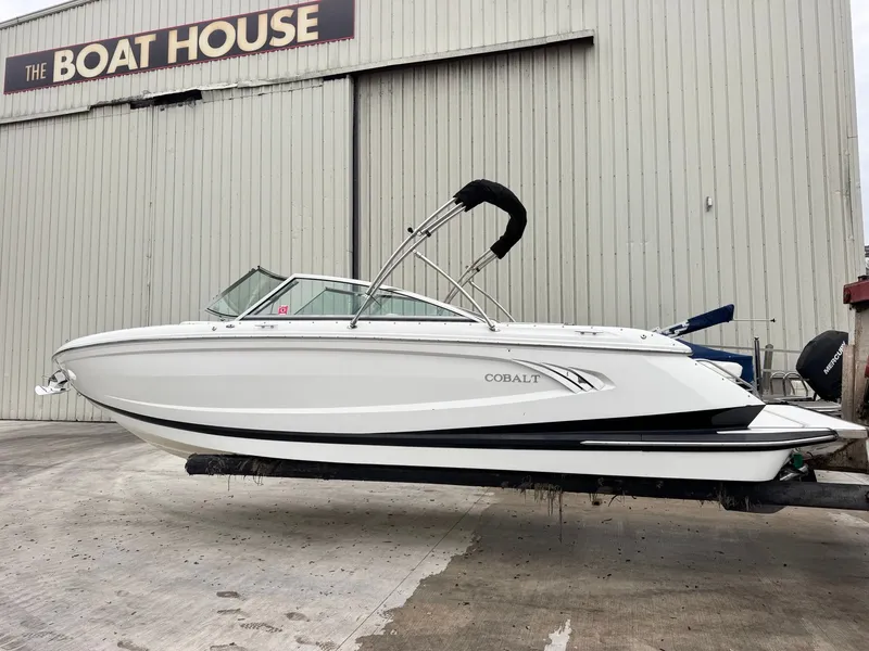 The Image of 2014 Cobalt A25 boat outside The Boat House building. - 1