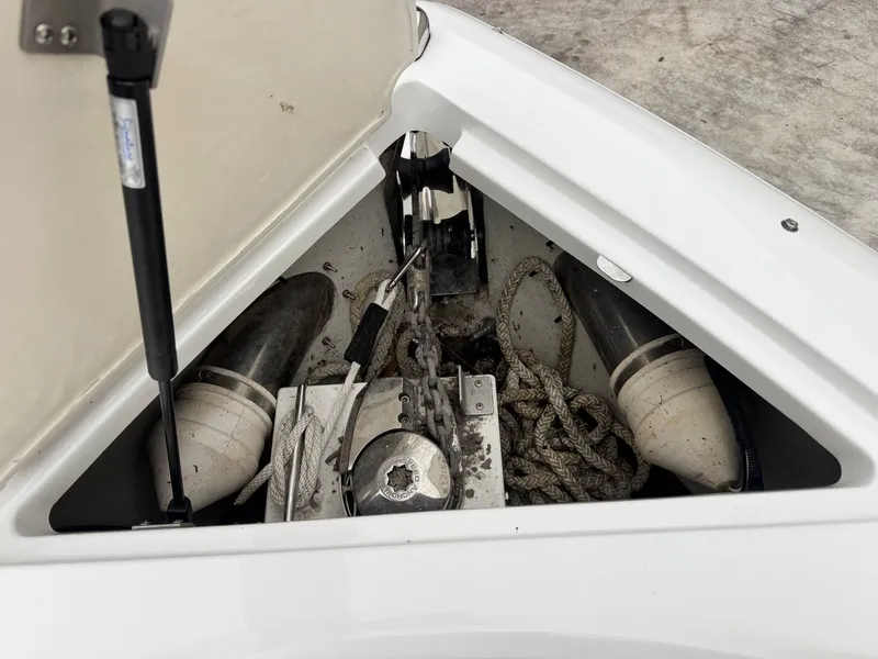 Slide: The Image of Anchor locker of a 2014 Cobalt A25 boat with ropes and windlass. - 15