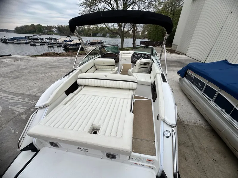 Slide: The Image of 2014 Cobalt A25 boat with white interior at dock. - 3