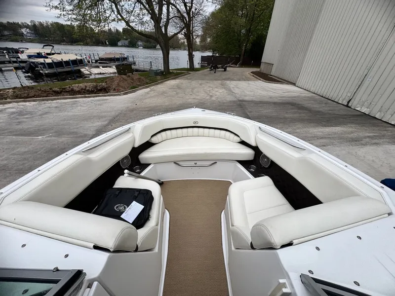 Slide: The Image of Interior view of a 2014 Cobalt A25 boat at the dock. - 8