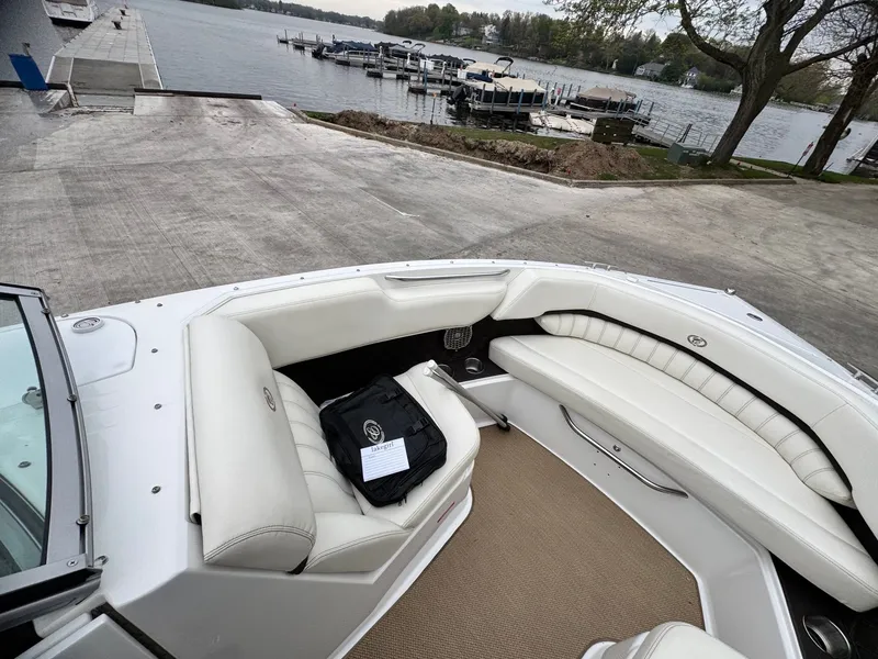 Slide: The Image of 2014 Cobalt A25 boat at lakeside with white interior. - 9