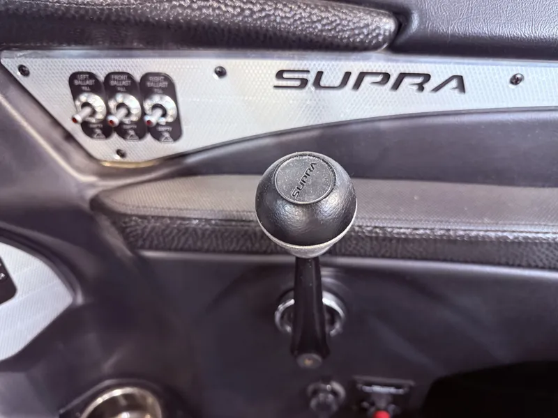 Slide: The Image of Interior of 2014 Supra SC350 with gear lever and controls. - 20