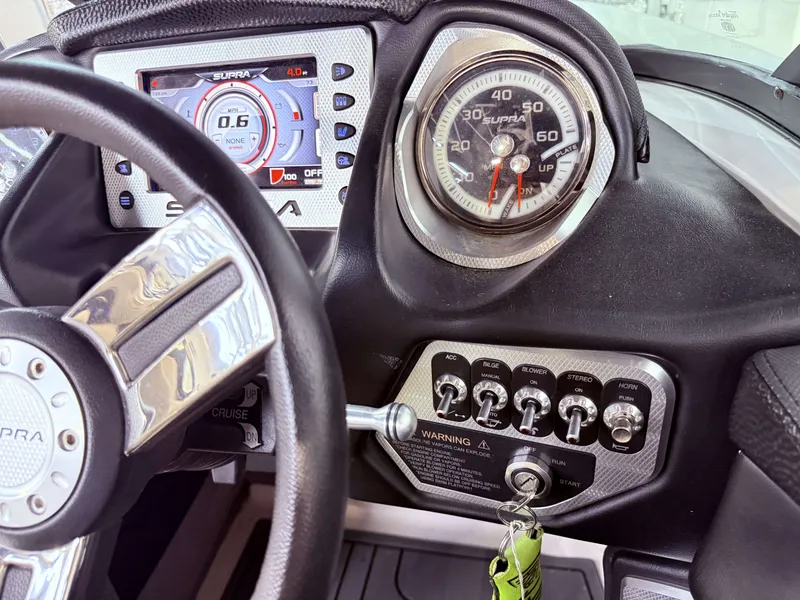 Slide: The Image of Dashboard of a 2014 Supra SC350 with tachometer and controls. - 22