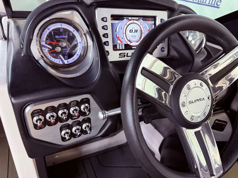 Slide: The Image of Dashboard of a 2014 Supra SC350 with tachometer and controls. - 27