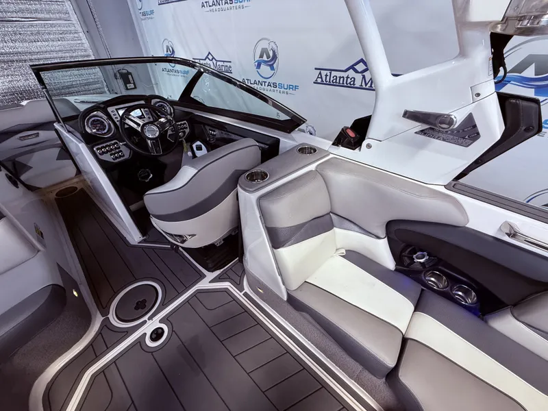 Slide: The Image of Interior of a 2014 Supra SC350 boat with modern seating and controls. - 31