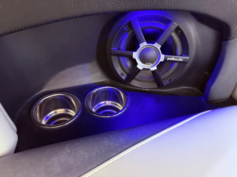 Slide: The Image of Speaker and cup holders in 2014 Supra SC350 interior. - 34