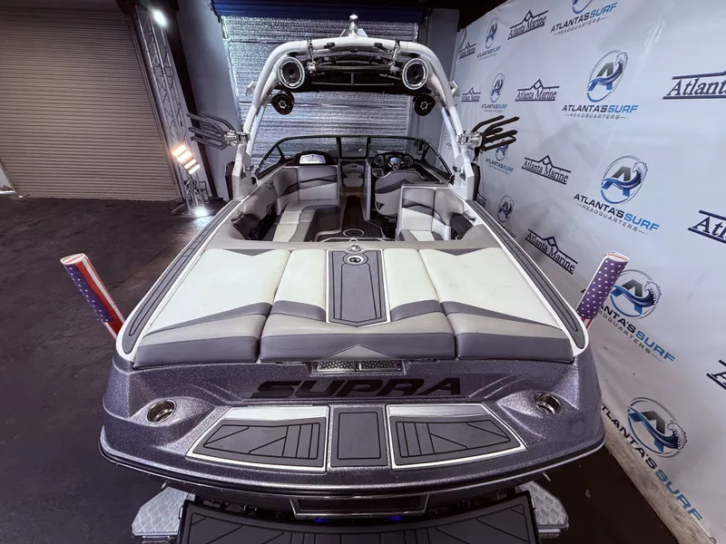 Slide: The Image of 2014 Supra SC350 boat in showroom with Atlanta Surf branding. - 9
