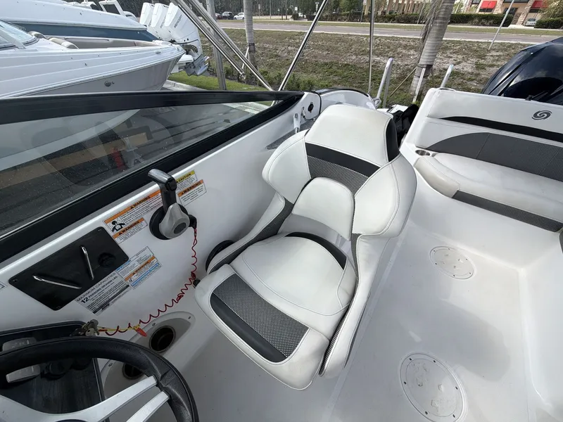 Slide: The Image of Interior of a 2020 Hurricane 2400 SD boat with steering console. - 11