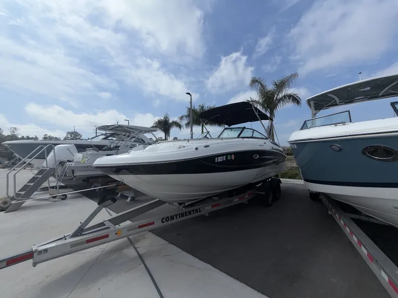 Slide: The Image of 2020 Hurricane 2400 SD boat on trailer outdoors. - 14