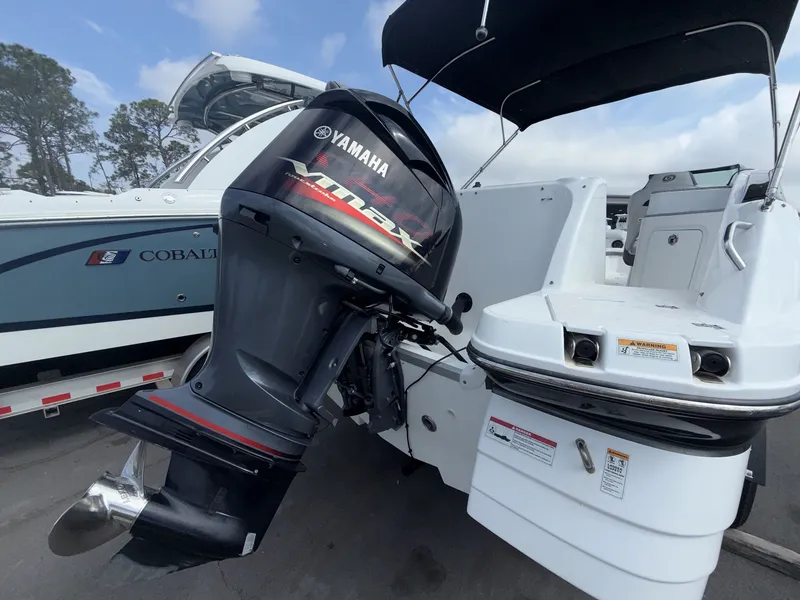 Slide: The Image of Yamaha outboard motor on a 2020 Hurricane 2400 SD boat. - 16