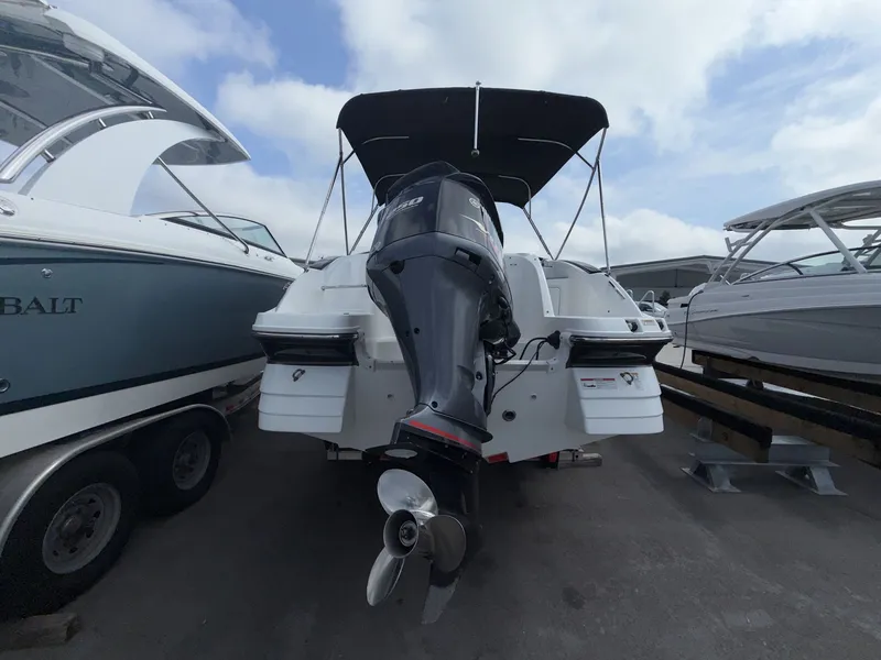 Slide: The Image of Rear view of a 2020 Hurricane 2400 SD boat in dock. - 17