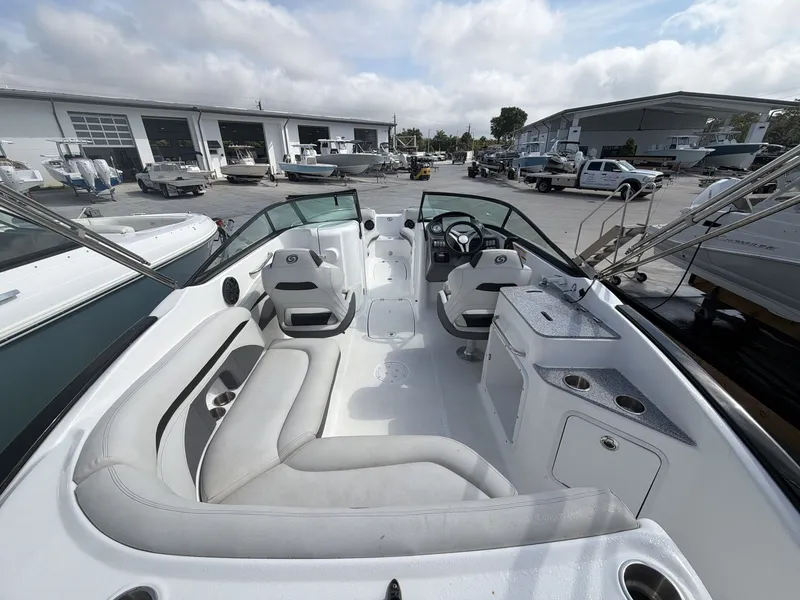 Slide: The Image of Interior view of a 2020 Hurricane 2400 SD boat at the dock. - 19