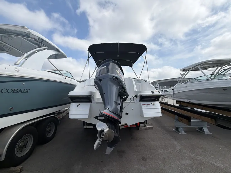 Slide: The Image of 2020 Hurricane 2400 SD boat with outboard motor on a trailer. - 6