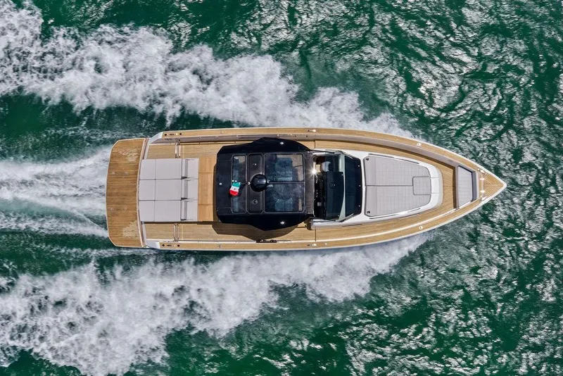 The Image of Aerial view of 2021 Pardo 43 yacht cruising on vibrant green water. - 0