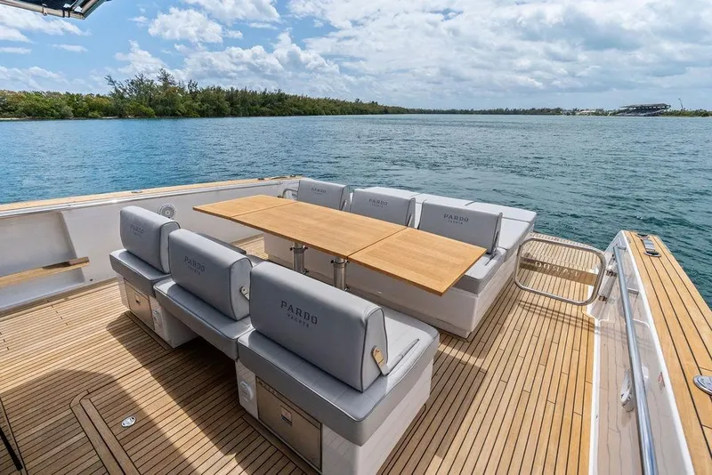 Slide: The Image of Luxury seating area on 2021 Pardo 43 yacht with scenic water view. - 11