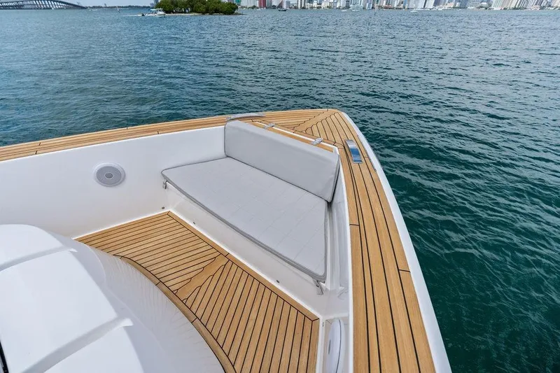 Slide: The Image of Luxury Pardo 43 yacht deck with teak flooring, 2021 model, overlooking serene waters. - 13