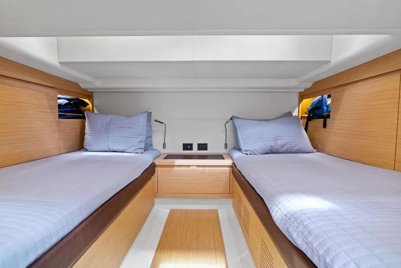 Slide: The Image of Interior of 2021 Pardo 43 yacht with twin beds and modern wood finish. - 21