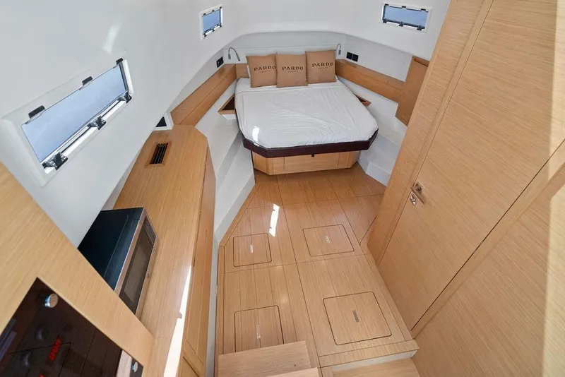 Slide: The Image of Luxurious interior of 2021 Pardo 43 yacht with modern wood finish and cozy bed. - 24