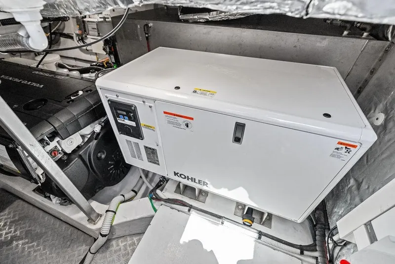 Slide: The Image of Engine room of 2021 Pardo 43 yacht featuring Kohler generator and Volvo Penta engine. - 25