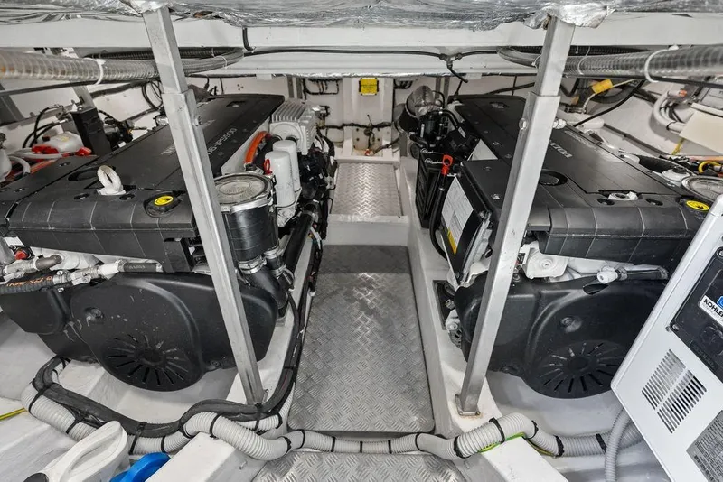 Slide: The Image of Engine room of a 2021 Pardo 43 yacht, featuring dual engines and mechanical components. - 26