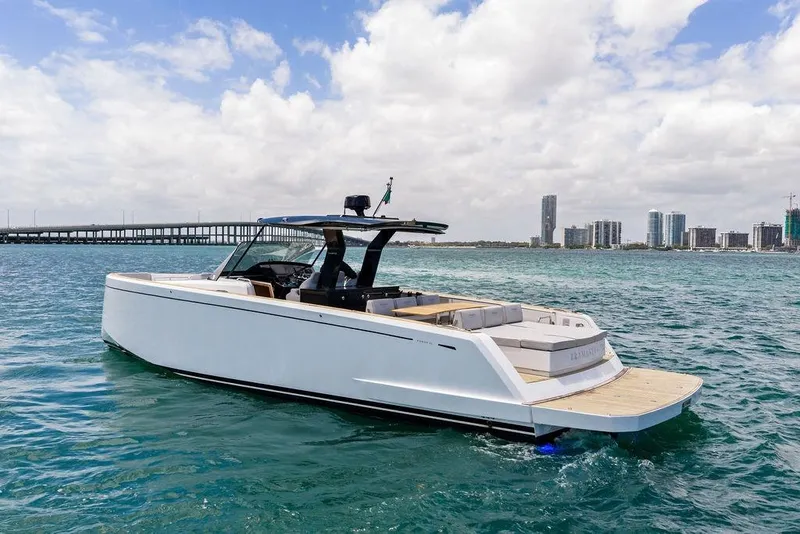 Slide: The Image of 2021 Pardo 43 yacht cruising on blue water near a city skyline. - 4