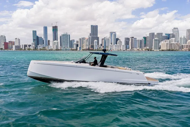 Slide: The Image of 2021 Pardo 43 yacht cruising near a city skyline on a sunny day. - 5