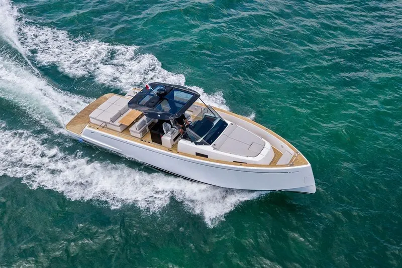 Slide: The Image of 2021 Pardo 43 yacht cruising on clear turquoise waters, showcasing sleek design and luxury. - 6