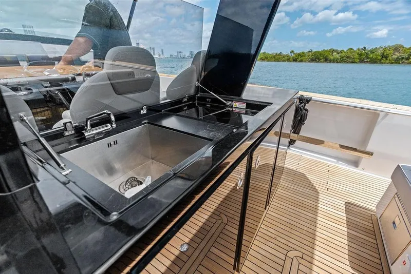 Slide: The Image of Luxury Pardo 43 yacht kitchen area with sleek design, 2021 model, on open water. - 7