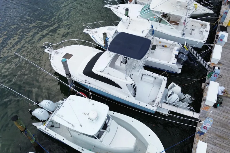 Slide: The Image of Aerial view of 1994 Luhrs 32 Convertible docked among other boats. - 13