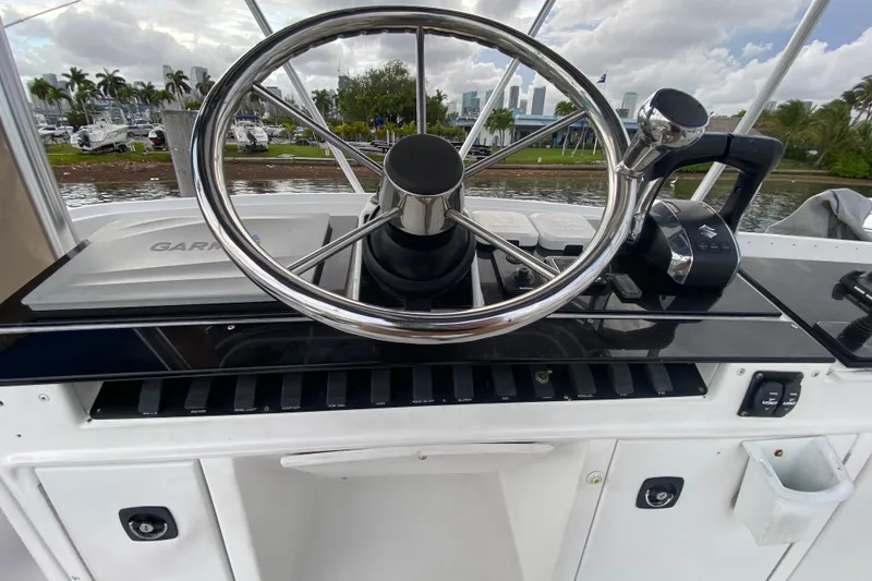 Slide: The Image of Helm of 1994 Luhrs 32 Convertible boat with steering wheel and controls. - 23