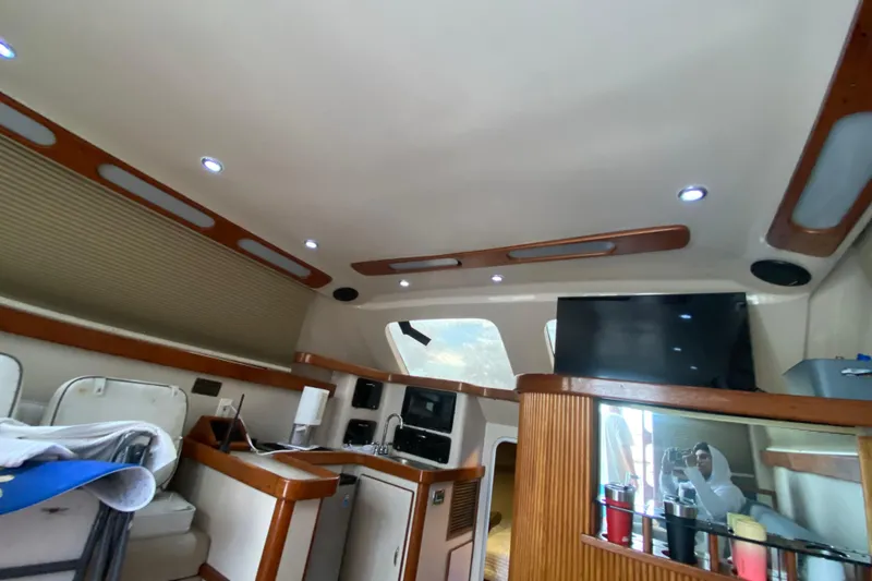 Slide: The Image of Interior of a 1994 Luhrs 32 Convertible boat with modern amenities. - 28