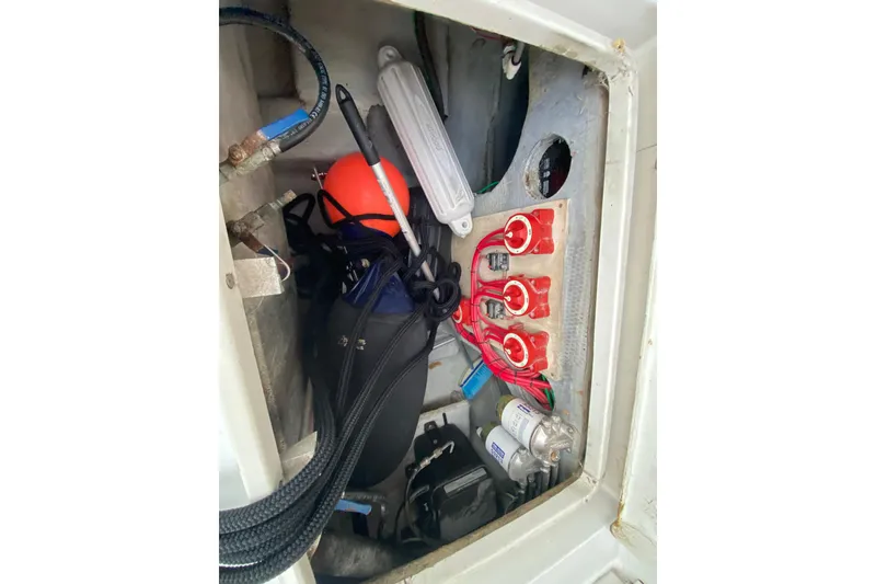 Slide: The Image of Electrical compartment of 1994 Luhrs 32 Convertible boat with wiring and components. - 48