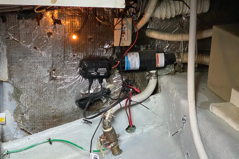 Slide: The Image of Electrical wiring and components inside a 1994 Luhrs 32 Convertible boat. - 49