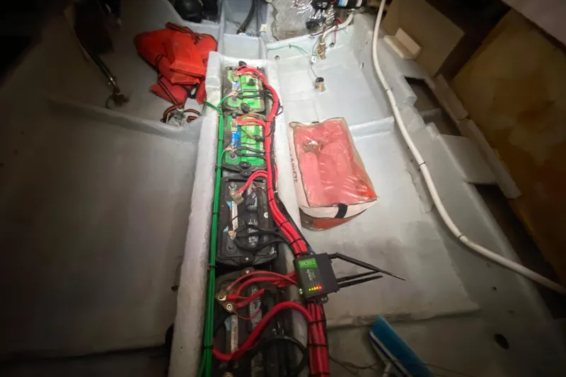 Slide: The Image of Electrical system and battery setup in a 1994 Luhrs 32 Convertible boat. - 50