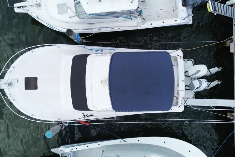 Slide: The Image of Aerial view of a 1994 Luhrs 32 Convertible boat docked at a marina. - 51