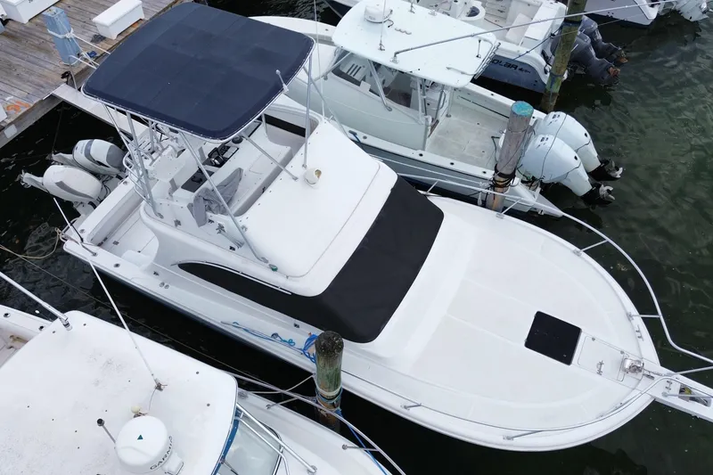 Slide: The Image of 1994 Luhrs 32 Convertible boat docked at marina, aerial view. - 7