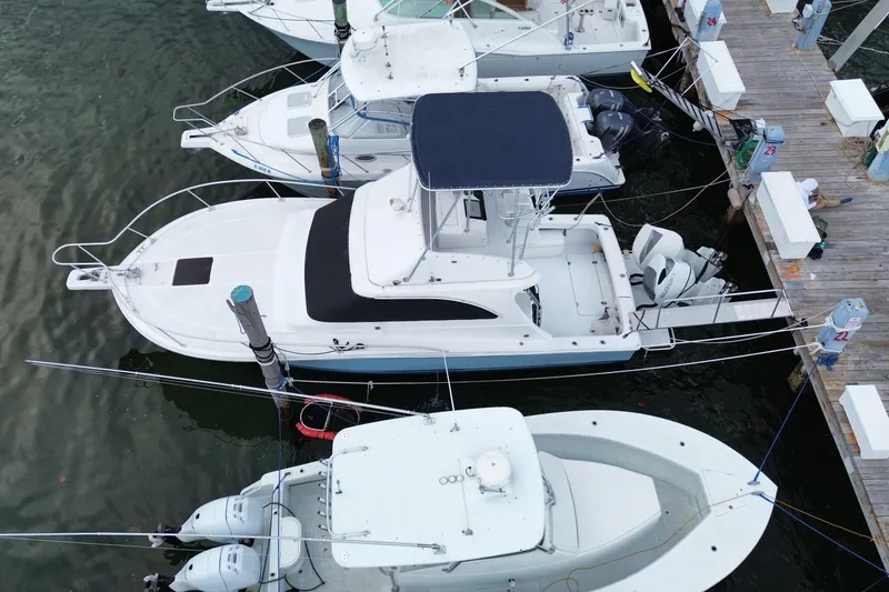Slide: The Image of Aerial view of a 1994 Luhrs 32 Convertible boat docked at a marina. - 8