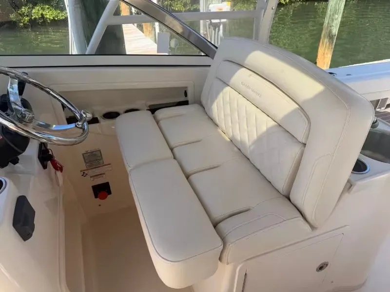 Slide: The Image of Interior of a 2018 Grady-White Freedom 307 boat with beige seating. - 15