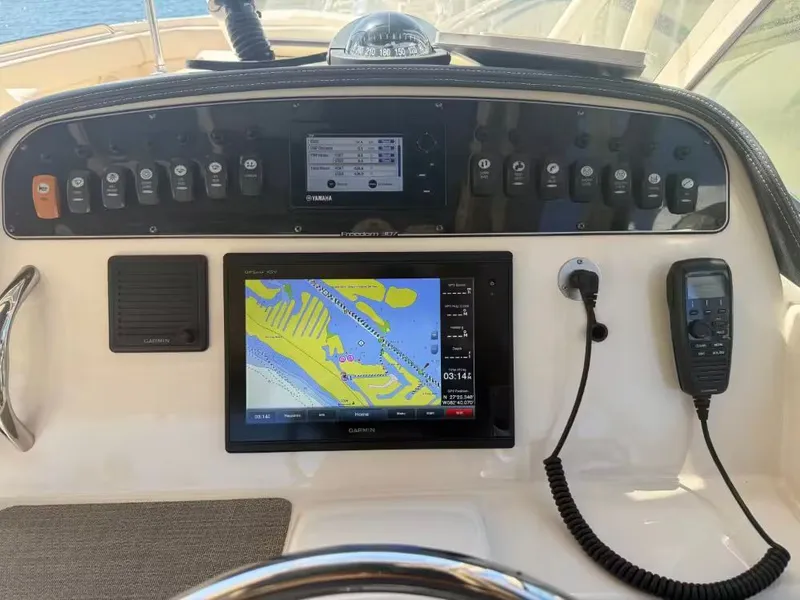 Slide: The Image of Grady-White Freedom 307 2018 boat console with Garmin navigation system. - 17