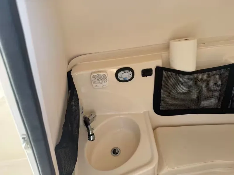 Slide: The Image of Interior of Grady-White Freedom 307 boat, featuring sink and storage. - 23