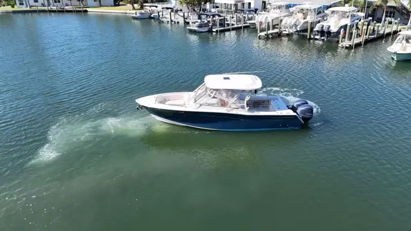 Slide: The Image of 2018 Grady-White Freedom 307 boat on calm water. - 3